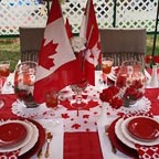 Canadian Stick flags decorate a table setting for Canada Day