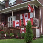 House decorated for Canada Day with lots of the maple leaf flags!