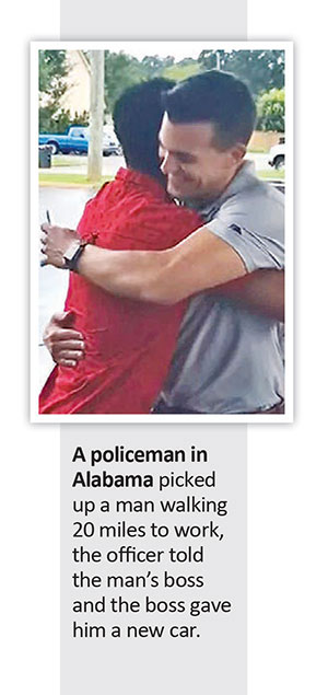 A policeman in Alabama hugs a man who was walking 20 miles to work