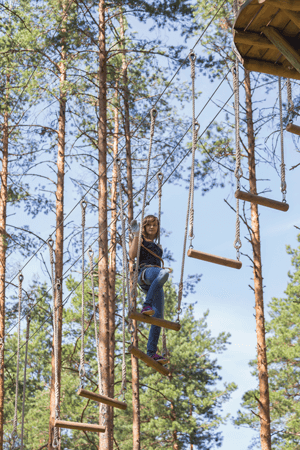 A girl on a ropes course