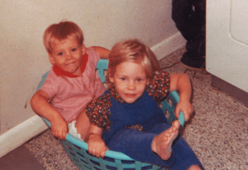 Madison with her brother as children playing