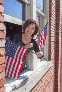 Kerry McCoy with American flags