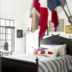 Flags mounted in spearhead bracket as bedroom decor