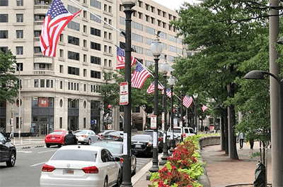 Supporters of statehood for D.C. put up flags with 51 stars. (WTOP/Mitchell Miller)