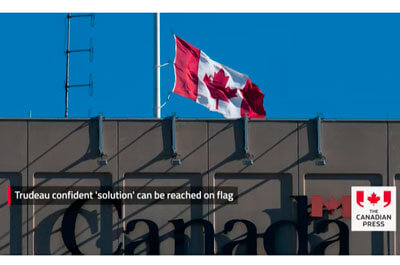 Trudeau says he is confident a “solution” will be reached to allow Canada to lower the flag to half-mast.