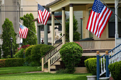 Flags flying on houses / Getty Images