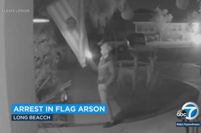 Video obtained by Eyewitness News shows a man approaching a home and grabbing an American flag that was anchored out front. He was seen setting it on fire. (ABC 7)