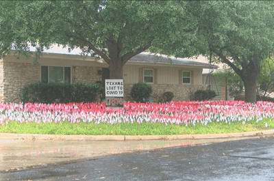 An Austin artist has planted a flag in his front yard for every Texan whose life was lost to COVID-19 (Photo: CBS Austin