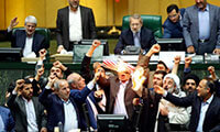  Iranian lawmakers burn two pieces of papers representing the U.S. flag and the nuclear deal/NY MAG