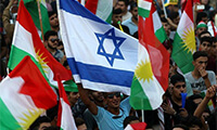 Iraqi Kurds fly an Israeli flag and Kurdish flags during an event to urge people to vote in the upcoming independence referendum in Erbil, the capital of the autonomous Kurdish region of northern Iraq, on September 16, 2017. (AFP/Safin Hamed)