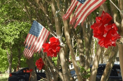 American flags and red bows on trees / Photo coutesry of delia A. Guajardo