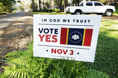 A yard sign calling for support for the "In God We Trust" flag in Jackson, Miss., on Oct. 27.Rogelio V. Solis / AP