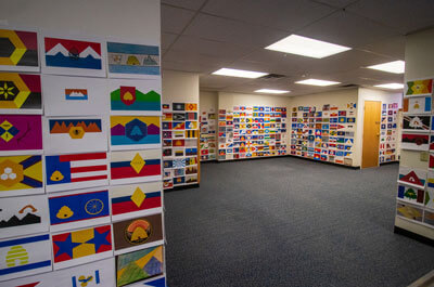 Some of the 5,703 Utah state flag designs posted to the walls of the Utah office building in Millcreek on Thursday. The state will narrow the field down to about 20 designed by August as it searches for a new state flag. (Photo: Carter Williams, KSL.com)