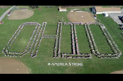 Hundreds of U.S. flags were positioned to spell OHIO Sunday morning on the west side of Richville Park in Perry Township (Photo courtesy of Daryl Smith)