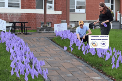 Pictured above placing the purple flags are SAF Program Specialist Sage Chase and SAF Advocate Laura Robinson (Oswego County Today)