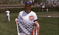 Rick Monday with the flag he saved / Baseball Hall of Fame