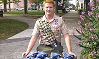 Eagle Scout candidate Matthew Gonsalves displays some of the flags he is seeking to reunite with their original owners. Rick Foster