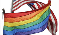 The rainbow flag flies beneath the American flag at the Stonewall National Monument on Oct. 11 in New York. (Mark Lennihan/AP)