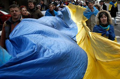 Ukraine supporters march through the streets of New York with flags and signs on February 24.John Lamparski/NurPhoto/Associated Press